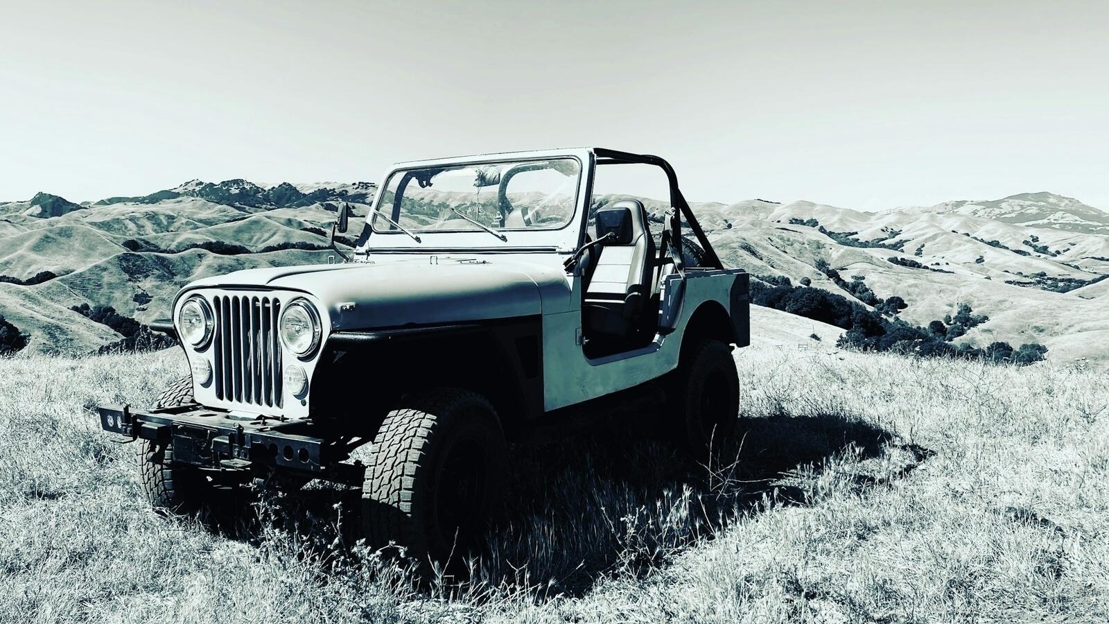 Jeeps in the distant desert